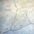 foundation heaving cracks in a slab floor in Olathe