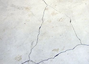 cracks in a slab floor consistent with slab heave in MissionMoberly.