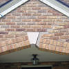 Major tuckpointing on a home archway over a door, with tuckpointing several inches wide that has failed on a Kansas City home