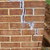 Tuckpointing that cracked due to foundation settlement of a Independence home