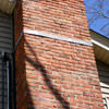 A tilting chimney on a Clinton home with a leaning, tilting chimney that was temporarily repaired.