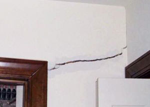 A large drywall crack in an interior wall in Lawrence