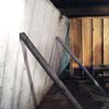 Temporary foundation wall supports stabilizing a Olathe home