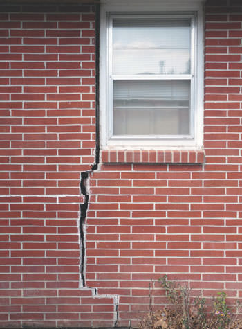severe foundation wall cracks along a window in Moberly