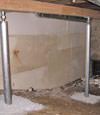 A system of crawl space support posts adding structural support to a crawl space in Marshall