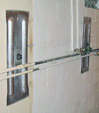 A foundation wall anchor system used to repair a basement wall in Marshall