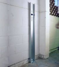 A failing foundation wall repaired with a foundation wall channel anchor system in a St. Joseph home.