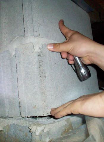 a completely failing concrete crawl space support pillar in Marshall