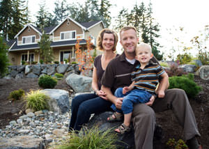 A happy family outside a home with a repaired foundation in Excelsior Springs