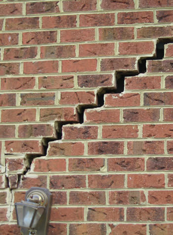 major cracking of a brick foundation wall in Harrisonville