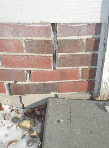 Severe street creep damage to a garage wall outside a Atchison home